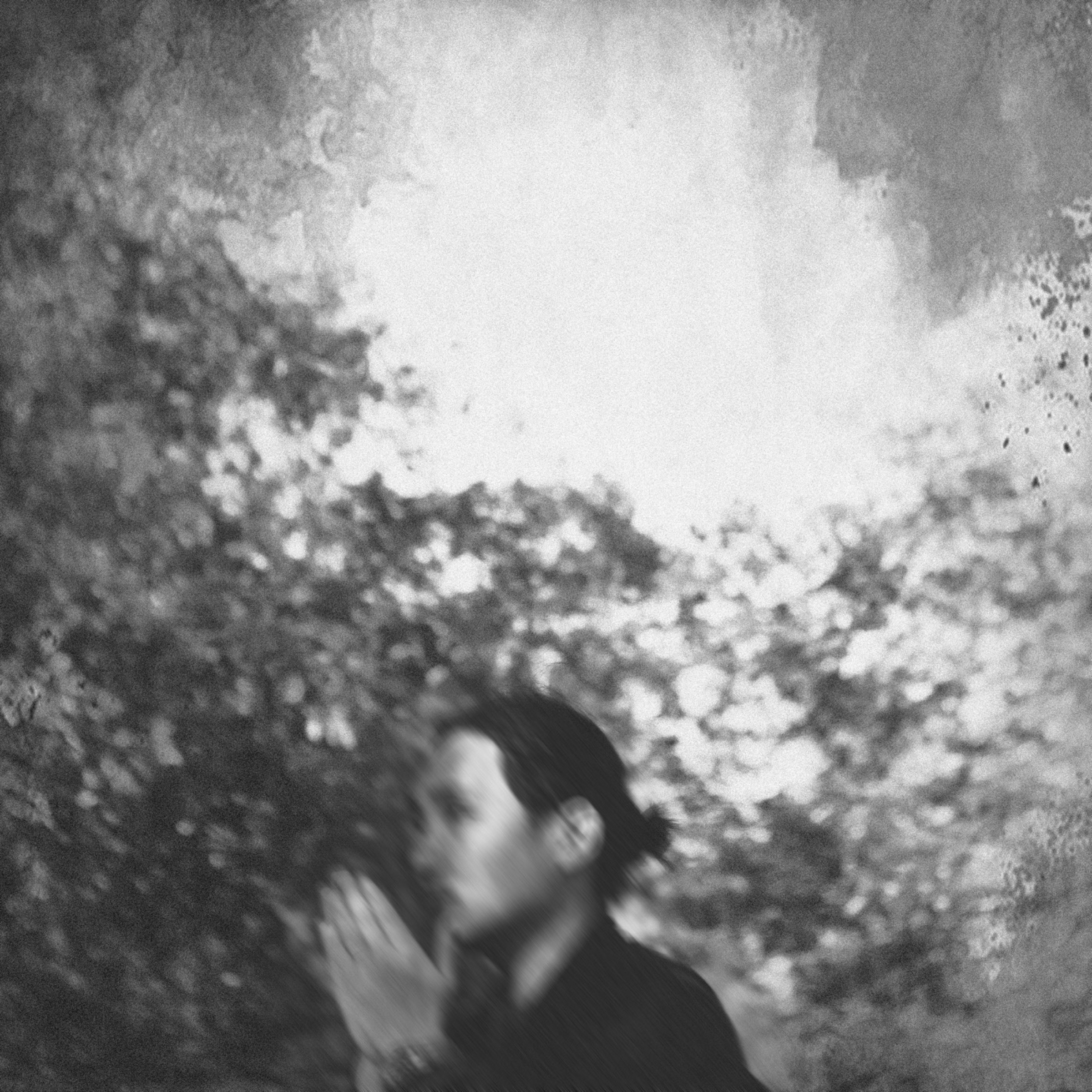 Blurred black-and-white self-portrait of Mario Wong